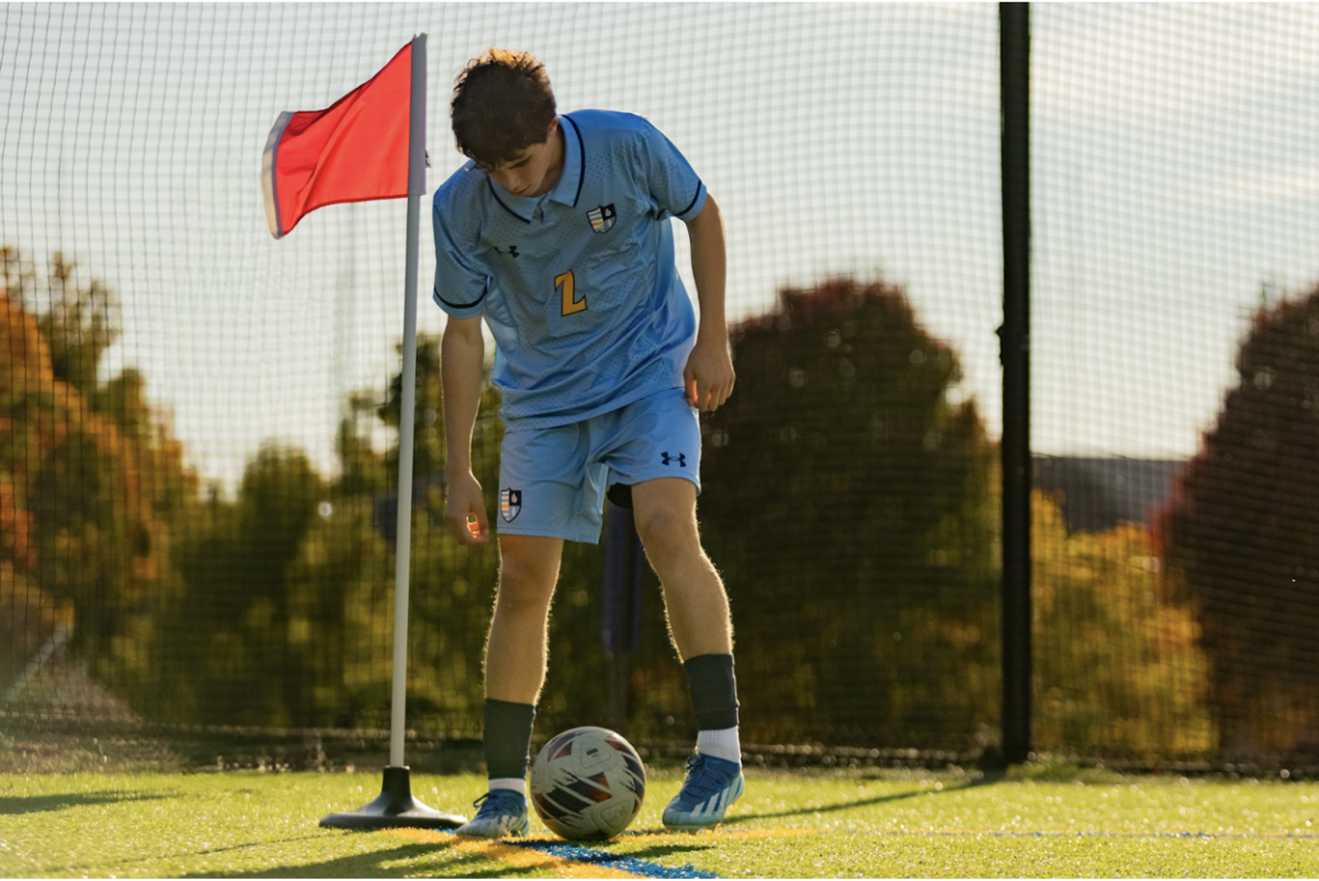 Sophomore Lev Eskin prepares to take a corner kick
